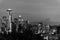 Black and white image of the skyline of the city of Seattle and the profile of Mount Rainier in the background.