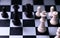 Black and white kings on chess board. Chess figure king. Black and white chess figurine.