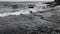 Black and white Lake Champlain waves over chazy limestone