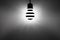 Black and white light concept. Striped glowing light bulb