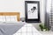 Black and white map in black frame in trendy bedroom interior with chequered bedroom