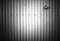 Black and white metal fence with empty socket background