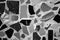 Black and white mosaic texture with various shapes