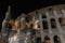 Black and white night view outside the Colosseum, Rome, Italy