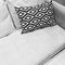 Black and white ornamental cushion on a sofa