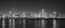 Black and white panoramic picture of Chicago city skyline at night.