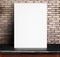 Black White paper poster lean at red brick wall and marble table