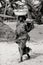 Black and white photo of African women carrying pots on their heads in Accra, Ghana