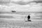 Black and white photo of a beach fisherman at the North Sea coast