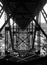 Black and white photo beneath the bridge at Deception Pass Washington