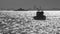 Black-and-white photo of boats in the sea of Marmara in the back