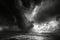 A black and white photo capturing the intensity of a storm above the vast expanse of the ocean, Dramatic black and white depiction