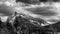 Black and White Photo of Dark clouds hanging over Mount Rundle in Banff National Park