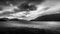 Black and White Photo of Dark Clouds and Lightning Strikes