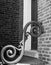 Black & white photo of decorative scrollwork on porch