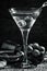 Black and white photo. Dry martini, vermouth with olives, wooden