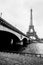 Black and white photo of Eiffel tower and Jena bridge