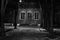 Black and white photo evening street lit by a lantern gloomy house on one of the streets