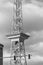 Black and white photo of the landmark Funkturm Berlin Radio Tower with foregrounded traffic lights