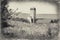 Black and white photo of a landscape with a silo and barn near Rectortown Virginia in Fauquier County.