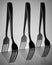 Black-and-white photo of Metal forks on a light background