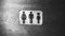 Black and white photo with noise. Gender neutral sign for the restroom. Inclusive concept