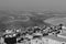 Black and white photo of panoramic view of the Mesopotamian plain and the city of Mardin in the foreground in Turkey