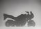 black and white photo of the shadow of the motorcycle is a childhood dream. selective focus