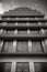 A Black And White Photo Of A Tall Building. Generative AI