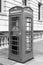 Black and white photo of a traditional phone box in London