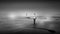 Black and White Photo of a Woman walking in Dense Fog on the Sandy Beach in Cox Bay