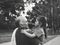 Black and white portrait of Happy grandfather and grandaughter playing at the park