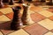 Black and white rooks stand on a chessboard with figures on background