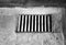 Black and white sewer grating background