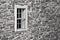Black and white stone slate wall with window