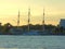 A black and white three-masted ship moored on the Neva river in Saint Petersburg, Russia