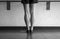 Black and white version of Dancer`s legs in jazz first back view