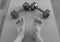 Black and white version of Feet and Dumbbells after a home workout on a yoga mat