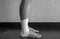 Black and white version of Side view of an Ankle tape job on an athleteâ€™s ankle