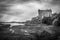 Black and white view of the Dunvegan castle overlooking the coast