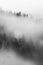 Black and white view to foggy mountains and hills