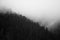 Black and white view to foggy mountains and hills