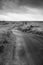 Black And White Walking Trail Leads To A House By The Grass Field On The Horizon In The Storm In Long Beach Washington