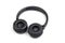 Black wireless headphones on white background.  Advanced acoustic stereo sound system