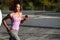 Black woman, afro hairstyle, running outdoors in urban road.