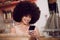 Black woman, afro or phone in coffee shop, cafe or restaurant on social media app, internet esports game or fashion blog