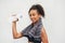 Black woman, athlete and drinking water in studio, portrait and hydration after workout on white background. Female