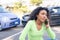 Black woman calling roadside service insurance support after car crash