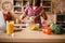 Black woman cooking salad on the kitchen