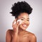 Black woman, cotton pad and skincare in studio with cleaning, makeup removal and happy by background. Young model, wipe